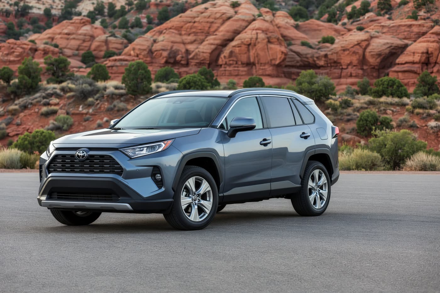 Blue-gray 2020 Toyota RAV4 on an asphalt lot