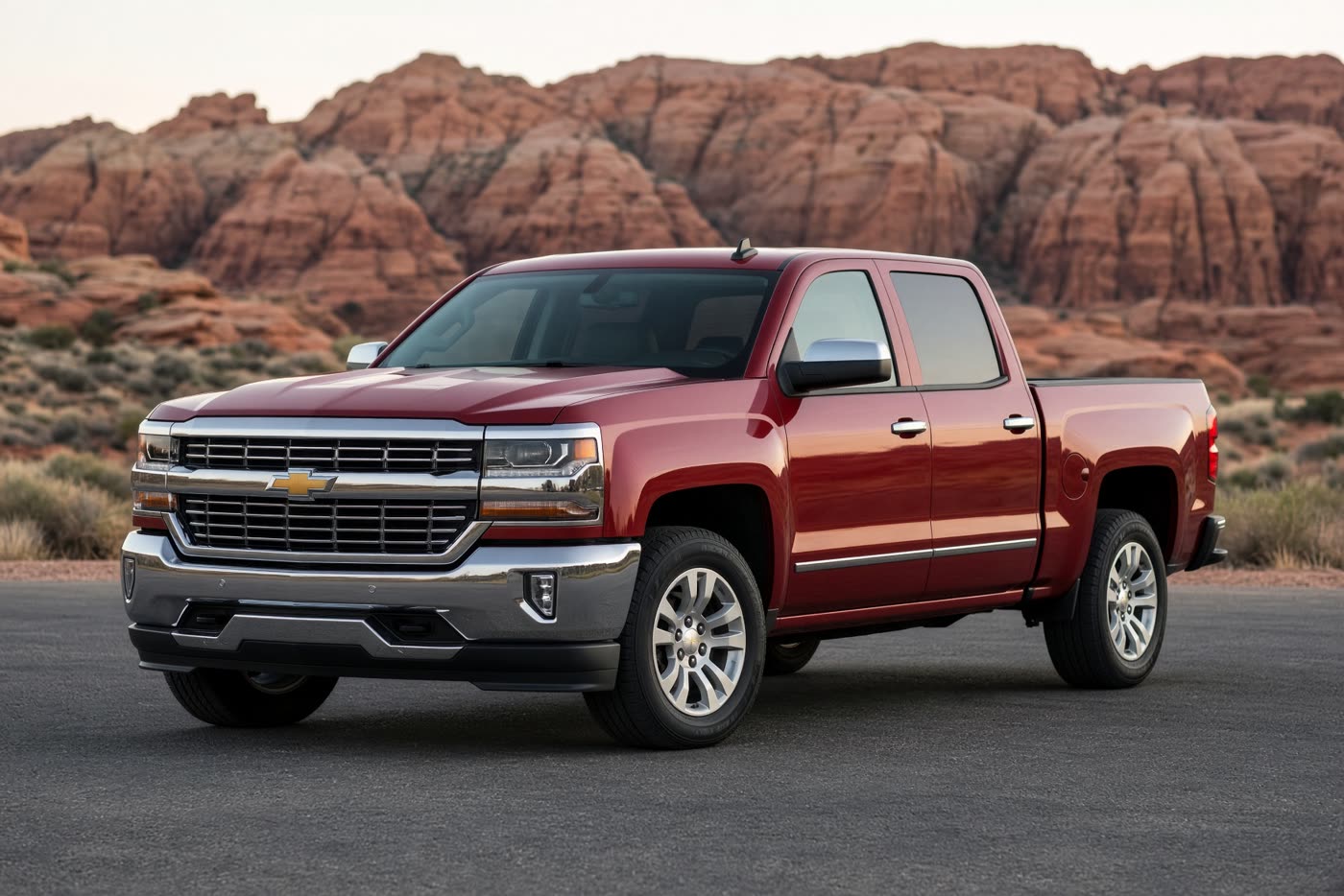 Red 2017 Chevrolet Silverado pickup on an asphalt lot